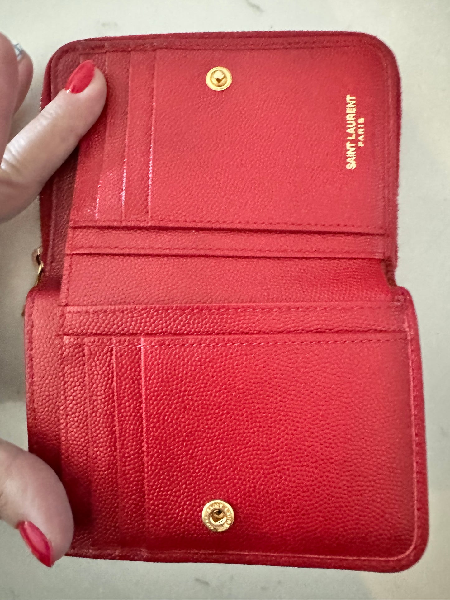 YSL Red CASSANDRE MATELASSÉ compact zip around wallet in grain de poudre leather