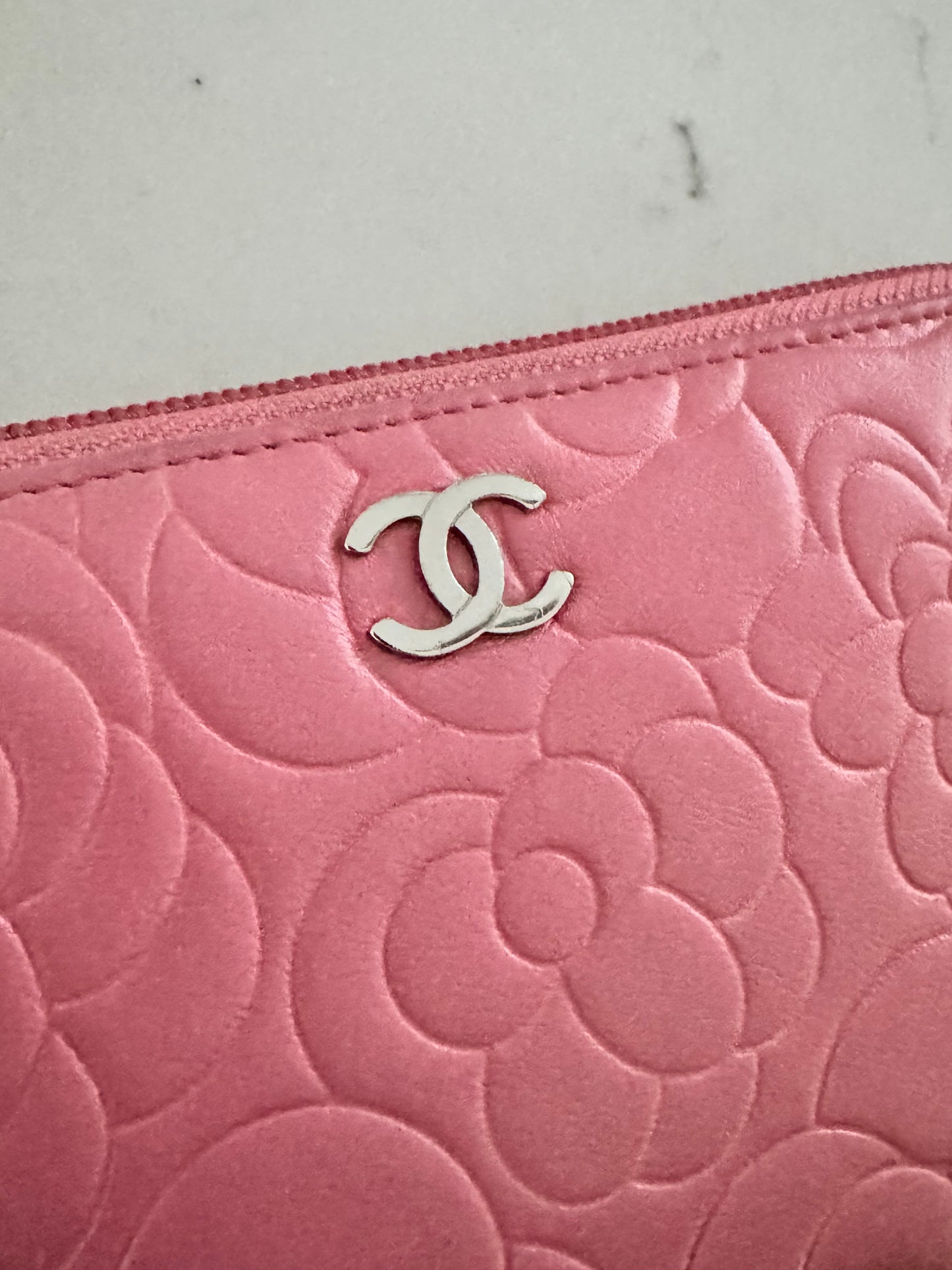 CHANEL Pink Lambskin Zip Around Camelia Wallet