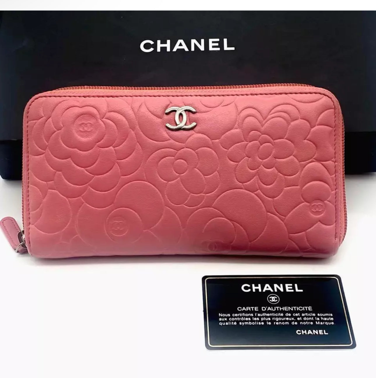 CHANEL Pink Lambskin Zip Around Camelia Wallet