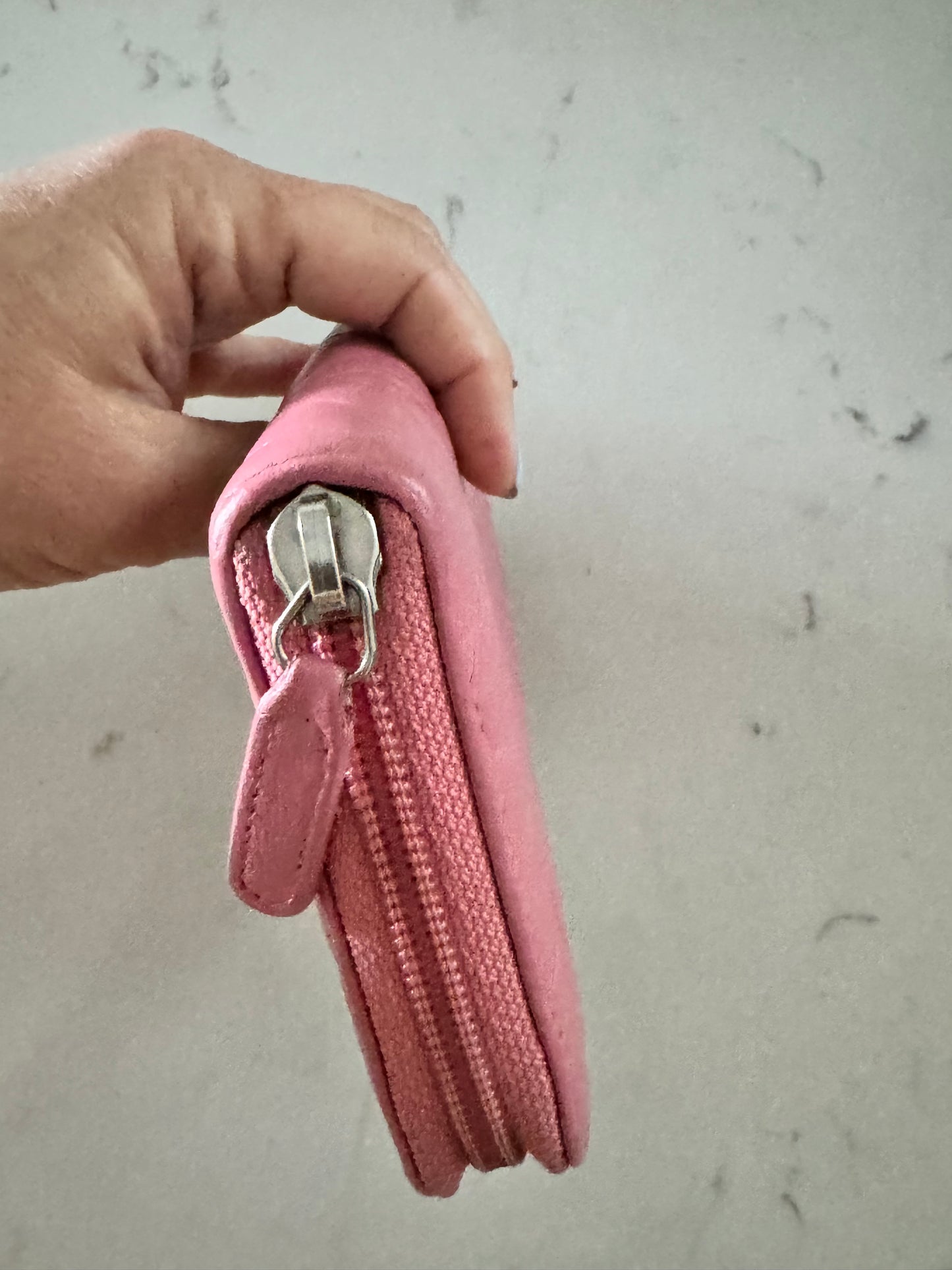CHANEL Pink Lambskin Zip Around Camelia Wallet