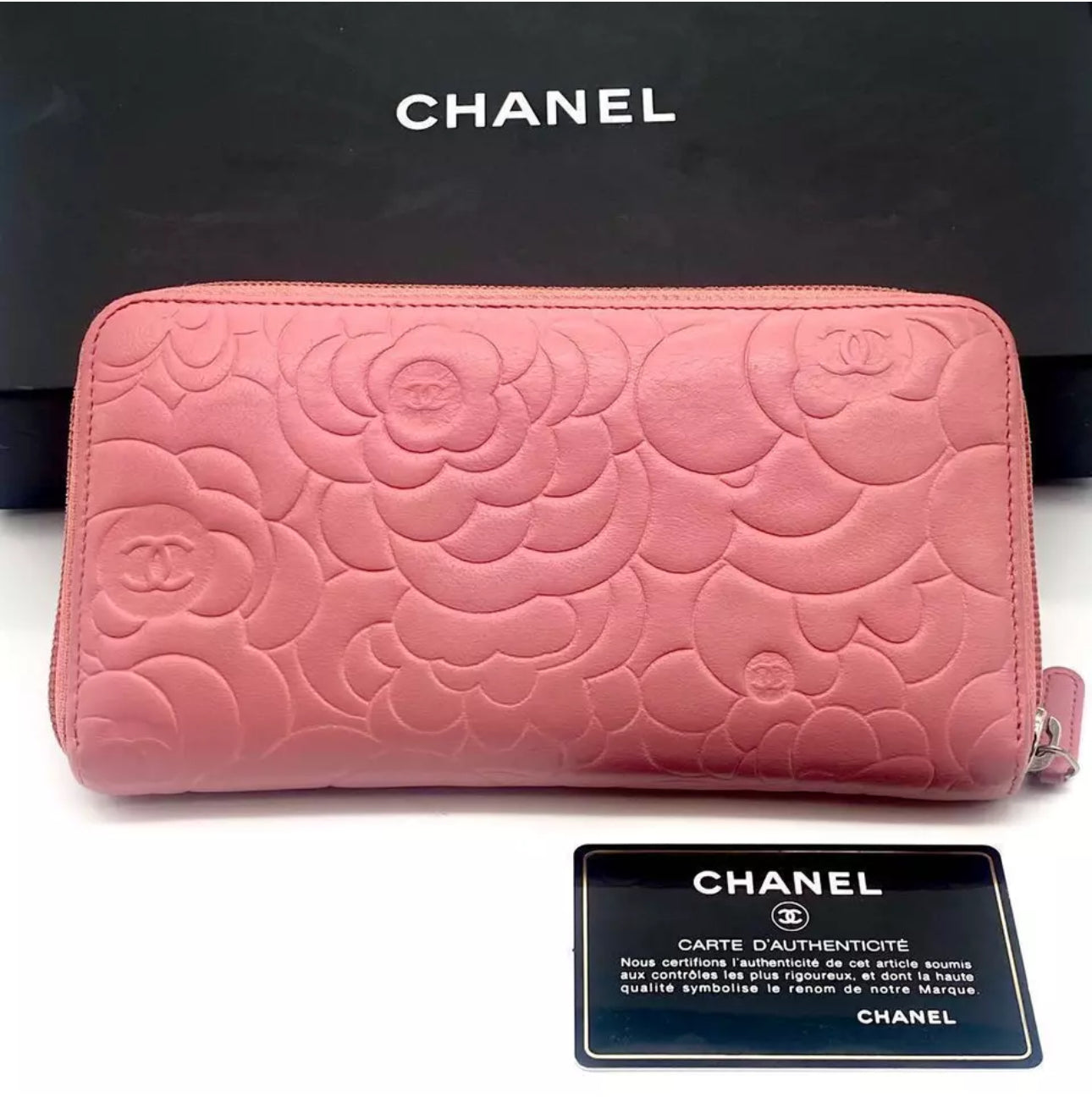 CHANEL Pink Lambskin Zip Around Camelia Wallet