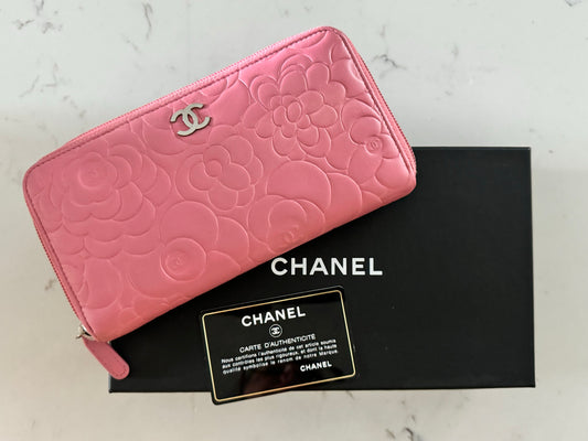 CHANEL Pink Lambskin Zip Around Camelia Wallet