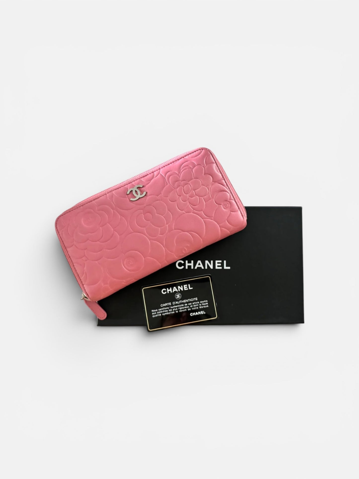 CHANEL Pink Lambskin Zip Around Camelia Wallet